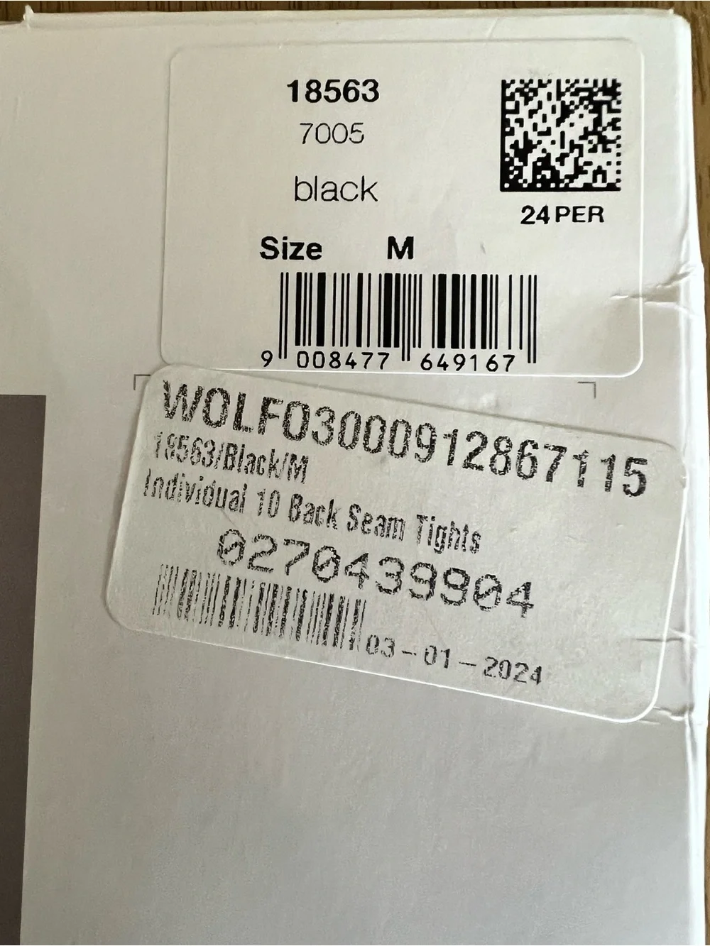 Wolford individual 10 back seam tights size M. Never worn in package. Black